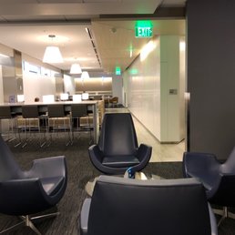 lounge chairs and a table in an office lounge chairs and a table in an office