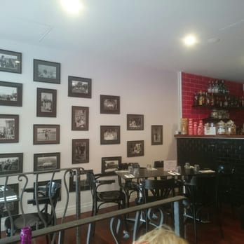 Otello Trattoria Pizzeria - Long family history of food and sharing shown on wall - Pizza Near Me - West End, QLD