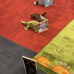 Niles-Maine District Library - Stuffed animals reading during evening storytime.