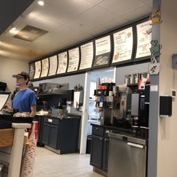 a man standing at the counter a man standing at the counter