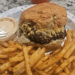 Double cheeseburger with seasoned fries and a side of special sauce. That's a strawberry lemonade