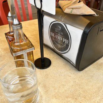 Island Pie - a glass of water and a bottle of liquor - Pizza Near Me - Deer Harbor, Washington Island Pie - a glass of water and a bottle of liquor - Pizza Near Me - Deer Harbor, Washington