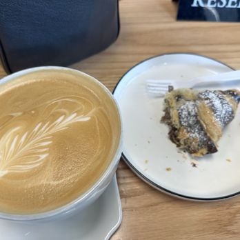 Sunflower Bakery and Cafe - Latte and half eaten chocolate croissant. Delicious! - Breakfast & Brunch Near Me - Meridian, Idaho Sunflower Bakery and Cafe - Latte and half eaten chocolate croissant. Delicious! - Breakfast & Brunch Near Me - Meridian, Idaho