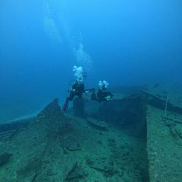 My fellow divers at the Kahala Barge wreck site. My fellow divers at the Kahala Barge wreck site.