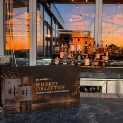 Prime Mēt Steakhouse - Outdoor bar with whiskey collection