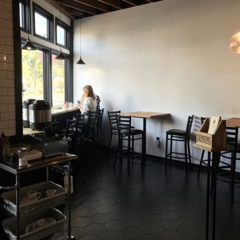 Denizens Cafe - a woman sitting at a table - Desserts Near Me - Portland, Oregon Denizens Cafe - a woman sitting at a table - Desserts Near Me - Portland, Oregon