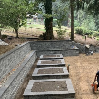Tross Build and Maintenance - Custom retaining wall and landscape construction in progress, featuring tiered masonry walls and raised planting beds - Handyman Near Me - Portland, Oregon Tross Build and Maintenance - Custom retaining wall and landscape construction in progress, featuring tiered masonry walls and raised planting beds - Handyman Near Me - Portland, Oregon