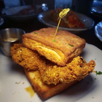 Moonshine Grill - Cornflake crusted chicken biscuit with hot honey. You'd be a full if u don't get this. - Southern Near Me - Austin, Texas