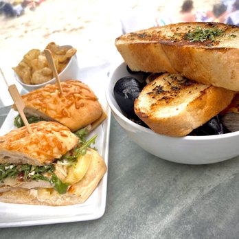 The Deck On Laguna Beach - Spicy chicken ciabatta sandwich on the left and Ciopino on the right - New American Near Me - Laguna Beach, California