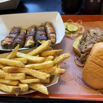 The Bearded Pig - Pulled pork sandwich with fries and poppers. - Barbeque Near Me - Jacksonville, Florida