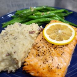 Charlie’s Place - Grilled salmon pan-seared and oven-finished. Served with garlic confit mashed potatoes and bacon-onion green beans.