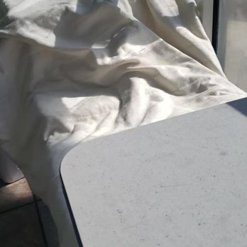 Super Laundry Wash & Fold - my cover lain over table to sun dry while I waited for a different dryer - Laundry Services Near Me - Gardena, California Super Laundry Wash & Fold - my cover lain over table to sun dry while I waited for a different dryer - Laundry Services Near Me - Gardena, California