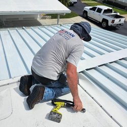 American Roofing - Our roofer secures new metal roofing panels on a Winter Haven home to ensure a durable and weather-tight installation.