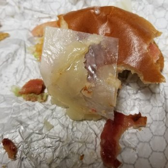 Wendy's - This sandwich was purchased from 608 S. College Mall Road. That is paper in my sandwich, I assume from the cheese that it comes on. - Fast Food Near Me - Bloomington, Indiana Wendy's - This sandwich was purchased from 608 S. College Mall Road. That is paper in my sandwich, I assume from the cheese that it comes on. - Fast Food Near Me - Bloomington, Indiana