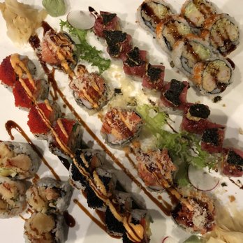 KanaHashi - Array of sushi. Shrimp tempura on corners, Tobiko at bottom mid left, Volcano in the middle, and Esctasy at the top mid right. - Japanese Near Me - Brooklyn, New York