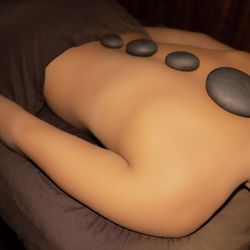 Hawaii Natural Therapy - Immerse yourself in the warmth of paradise with our Hot Stone Massage enhancements in Honolulu. Let the soothing heat melt away tension.