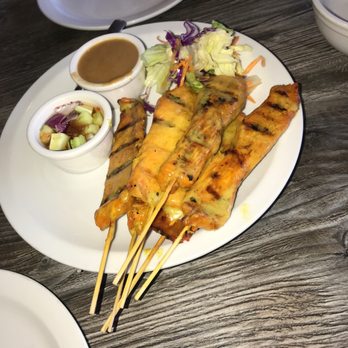 Thai Delight - Chicken satay with peanut sauce dipping and small cucumber salad - Thai Near Me - Phoenix, Arizona Thai Delight - Chicken satay with peanut sauce dipping and small cucumber salad - Thai Near Me - Phoenix, Arizona