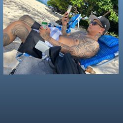 Kaiona Beach Park - My husband lounging with a beer