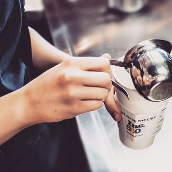 Five Lakes Coffee - a person holding a cup of coffee - Coffee & Tea Near Me - Sturgis, Michigan