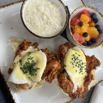Young Cardinal Cafe - Hot honey chicken Benedict with a biscuit and grits. - Breakfast & Brunch Near Me - Winston-Salem, North Carolina Young Cardinal Cafe - Hot honey chicken Benedict with a biscuit and grits. - Breakfast & Brunch Near Me - Winston-Salem, North Carolina