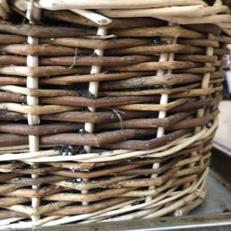 You can see the potting soil spilling out from between the slats of the basket You can see the potting soil spilling out from between the slats of the basket