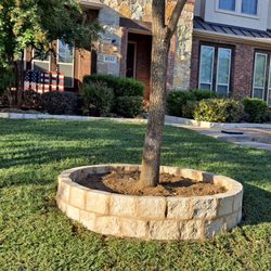 Patio's Guzman - Stone surround for plants to prevent soil overflow and decoration.