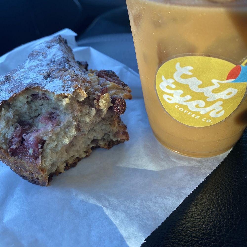 Triptych Coffee - Cold brew with brown sugar vanilla syrup and a strawberry scone. - Coffee & Tea Near Me - Denton, Texas Triptych Coffee - Cold brew with brown sugar vanilla syrup and a strawberry scone. - Coffee & Tea Near Me - Denton, Texas