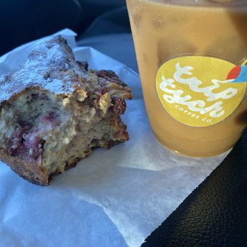 Triptych Coffee - Cold brew with brown sugar vanilla syrup and a strawberry scone. - Coffee & Tea Near Me - Denton, Texas Triptych Coffee - Cold brew with brown sugar vanilla syrup and a strawberry scone. - Coffee & Tea Near Me - Denton, Texas