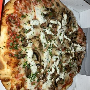 550 Pizza - Mushroom pizza. Tasty. Just looks a little funky because I'm eating outside and used a flash - Pizza Near Me - Los Angeles, California 550 Pizza - Mushroom pizza. Tasty. Just looks a little funky because I'm eating outside and used a flash - Pizza Near Me - Los Angeles, California