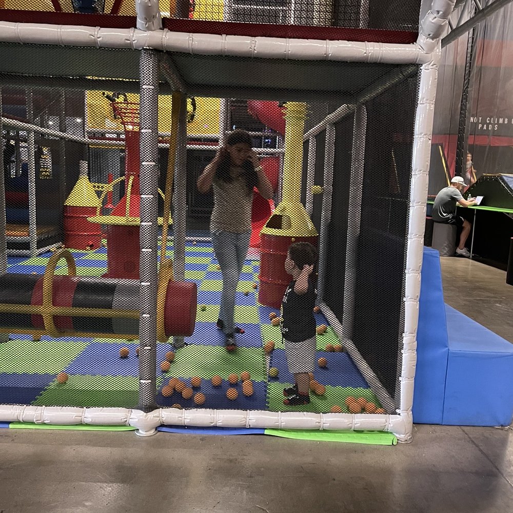 Uptown Jungle Fun Park - One of the areas with a slide and a ton of soft balls you can shoot and play with, there's also a cool swing. - Trampoline Parks Near Me - Peoria, Arizona
