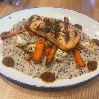 Tupelo Honey Southern Kitchen & Bar - Salmon on creamy quinoa - New American Near Me - Irving, Texas Tupelo Honey Southern Kitchen & Bar - Salmon on creamy quinoa - New American Near Me - Irving, Texas