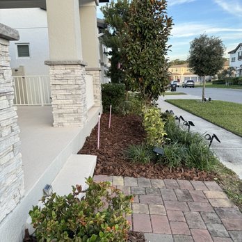 AngelGreen Outdoors - a front yard with brick pavers - Lawn Services Near Me AngelGreen Outdoors - a front yard with brick pavers - Lawn Services Near Me