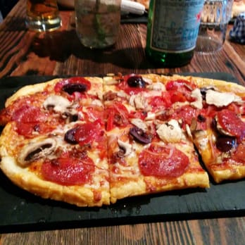 The Parlour - Yummy "The Standard" with bacon, pepperoni, mushrooms, on Gluten-free bread. So oily and chewy. Really good pizza. - Pizza Near Me - Vancouver, British Columbia The Parlour - Yummy "The Standard" with bacon, pepperoni, mushrooms, on Gluten-free bread. So oily and chewy. Really good pizza. - Pizza Near Me - Vancouver, British Columbia