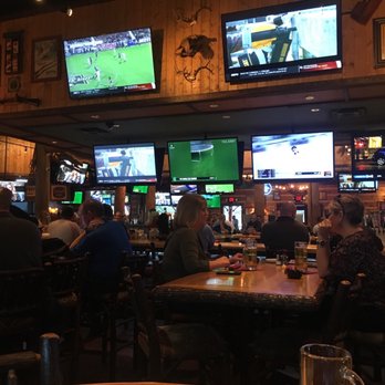 Twin Peaks - Tv and the bar in the back - Sports Bars Near Me - Webster, Texas
