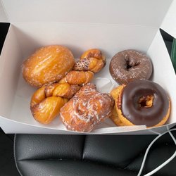 Mister Donut - Jelly-filled, cinnamon twist, Apple fritter, chocolate iced, chocolate cake, & chocolate frosted cake