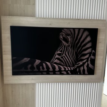 Tech Pro Repair - Peace of art, frame TV was professionally mounted by us, 3mm between the wall and TV. - Electronics Repair Near Me - Wilton Manors, Florida