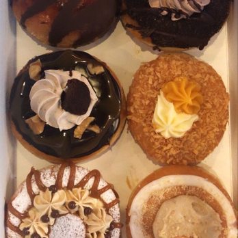 Mojo Donuts - Top: creme brûlée, death by chocolate, middle: brownie, mango island, bottom: quatros Leche, banana creme - Donuts Near Me - Pembroke Pines, Florida
