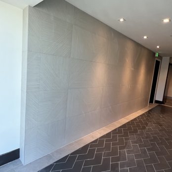 Zapata Floors - Wall tiled up with 24x48 porcelain tile - Flooring Near Me Zapata Floors - Wall tiled up with 24x48 porcelain tile - Flooring Near Me