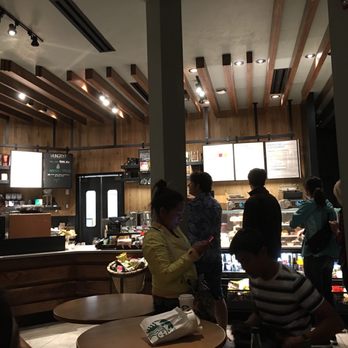 Starbucks - a group of people in a coffee shop - Coffee & Tea Near Me - Banff, Alberta Starbucks - a group of people in a coffee shop - Coffee & Tea Near Me - Banff, Alberta