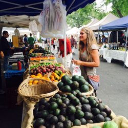 Local Harvest Delivery - Owner Julie collecting produce at the market for delivery.