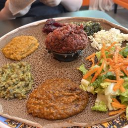 Kitfo, meat and veggie combo Kitfo, meat and veggie combo