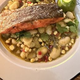 The salmon was cooked. Perfect perfection I highly recommend this dish.