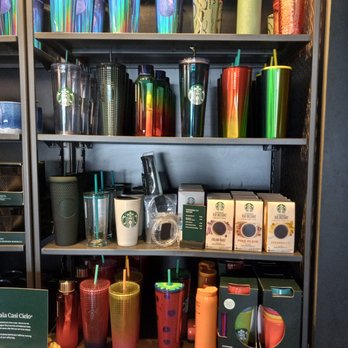 Starbucks - a shelf full of starbucks tumbles and coffee cups - Coffee & Tea Near Me - Memphis, Tennessee Starbucks - a shelf full of starbucks tumbles and coffee cups - Coffee & Tea Near Me - Memphis, Tennessee