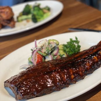 Doc B's Restaurant + Bar - Ribs and Cucumber Salad - New American Near Me - Chicago, Illinois Doc B's Restaurant + Bar - Ribs and Cucumber Salad - New American Near Me - Chicago, Illinois