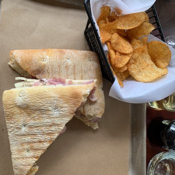 Slanted Window Tasting Station - Rustic sandwich - prosciutto, manchego cheese, artichoke olive spread with spicy Mayo on focaccia bread.  (Super tasty) - Wine Tasting Room Near Me - Franklin, North Carolina