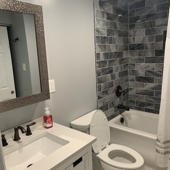 Wise Construction - a bathroom with a sink, toilet, and bathtub - General Contractors Near Me Wise Construction - a bathroom with a sink, toilet, and bathtub - General Contractors Near Me