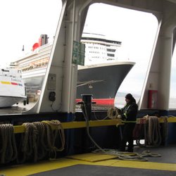 Société des Traversiers du Québec - Pulling up and coiling the rope that moors the ferry to the quai.