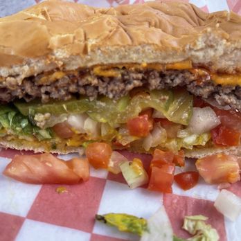 Chris Madrid's - Cross section of the regular cheese burger with everything including ketchup. - Burgers Near Me - San Antonio, Texas Chris Madrid's - Cross section of the regular cheese burger with everything including ketchup. - Burgers Near Me - San Antonio, Texas