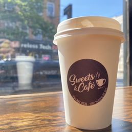 a cup of coffee on a table a cup of coffee on a table