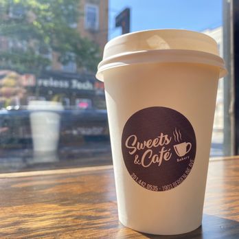 Sweets & Cafe Bakery - a cup of coffee on a table - Desserts Near Me - Union City, New Jersey Sweets & Cafe Bakery - a cup of coffee on a table - Desserts Near Me - Union City, New Jersey